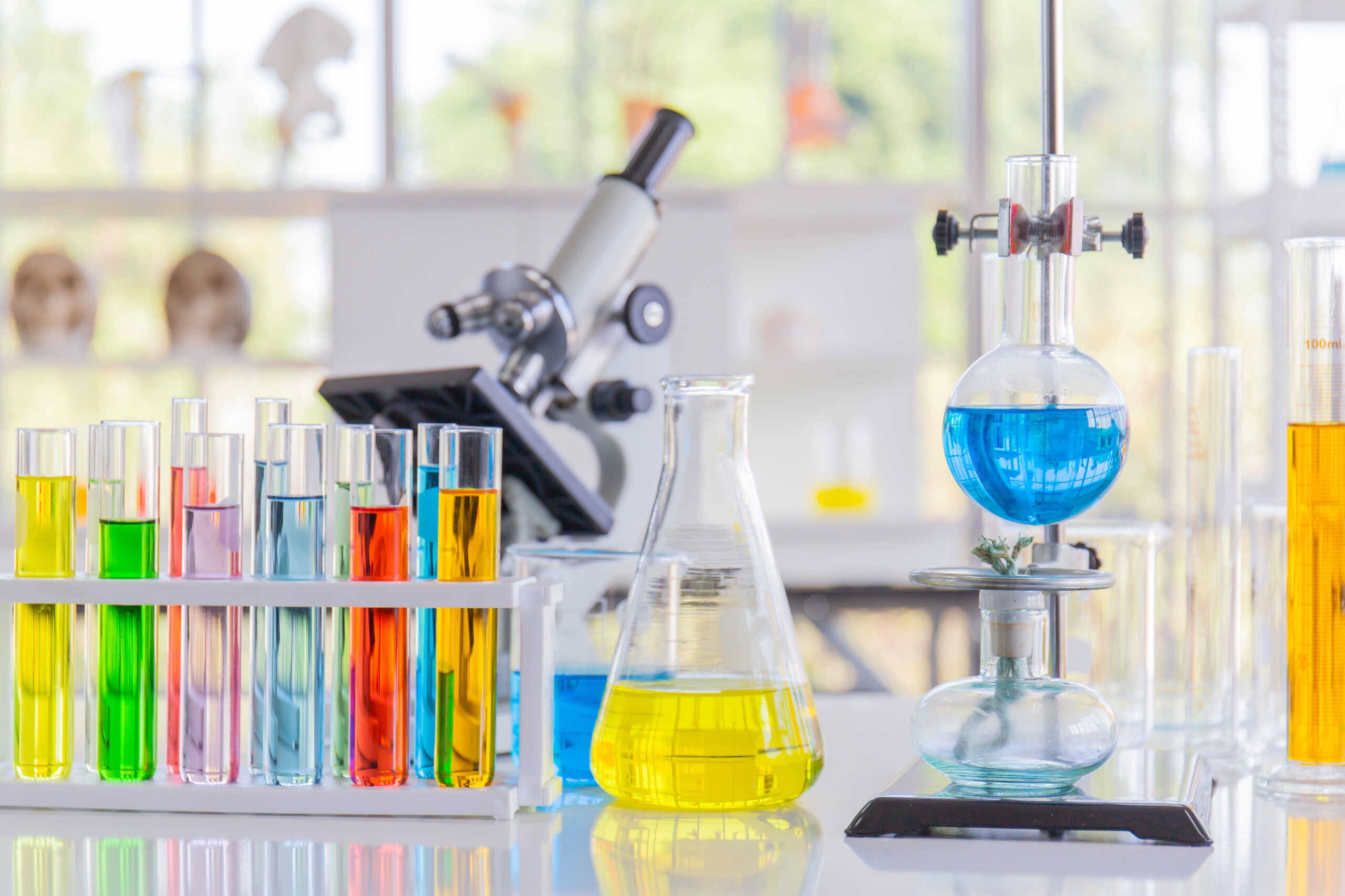 Chemical reagents in glass bottles of various shapes, scientific